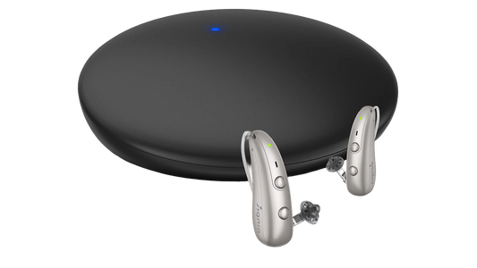 Signia TV Sound accessory for Signia Pure Charge&Go BCT IX hearing aids, showing device connected to a TV for audio streaming.