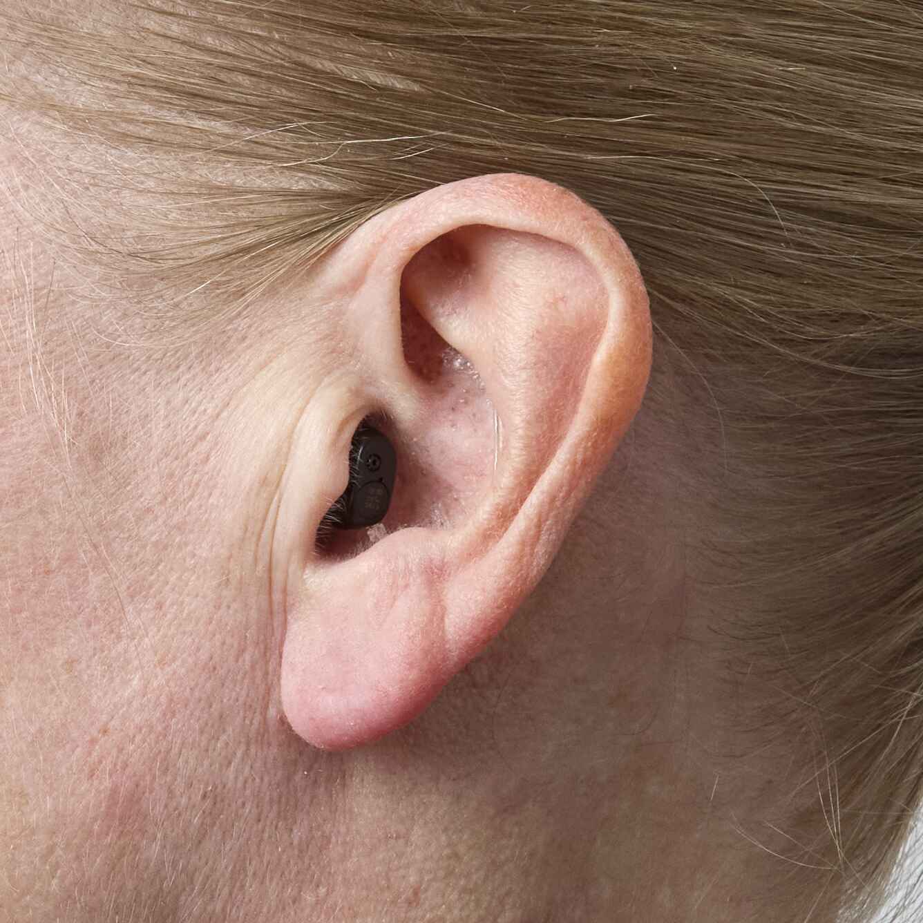 Oticon Zeal worn in-ear — nearly invisible